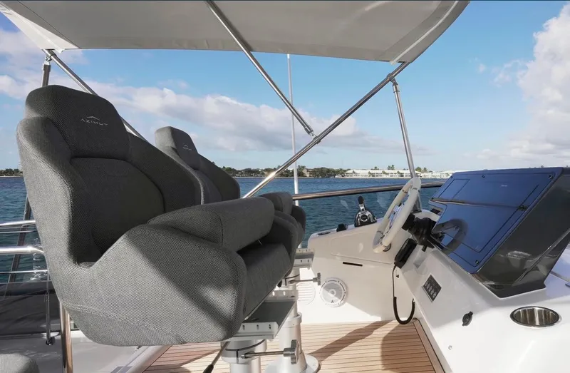  Yacht Photos Pics 2021 Azimut S6 Sports Fly yacht helm with luxurious seating and ocean view.
