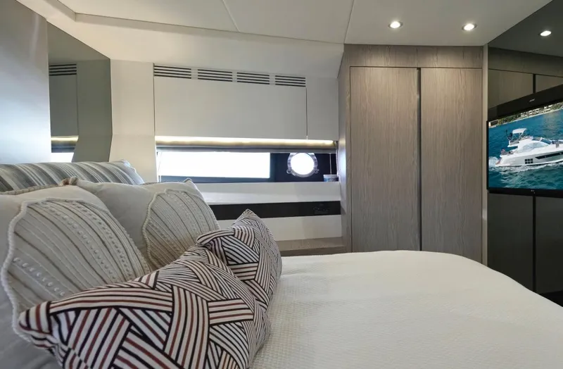  Yacht Photos Pics Luxurious bedroom interior of 2021 Azimut S6 Sports Fly yacht with modern decor.