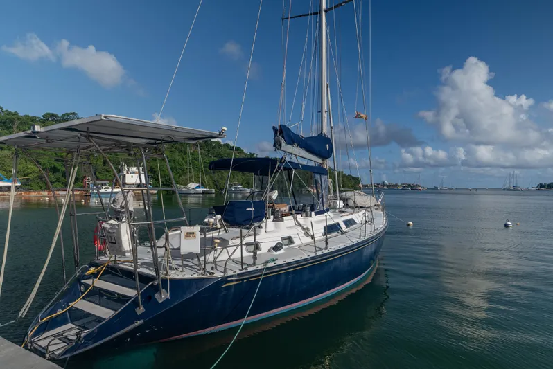 4 Knots Yacht Photos Pics Sailboat docked in serene marina, Hylas 51, 1990 model.