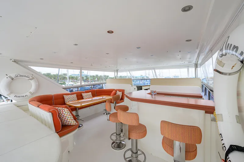 Miss Dunia Yacht Photos Pics Luxurious 2008 Hargrave Raised Pilothouse yacht interior with seating and bar area.