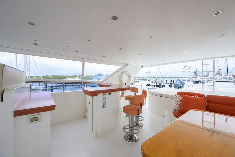 Miss Dunia Yacht Photos Pics Luxurious 2008 Hargrave Raised Pilothouse yacht interior with seating and bar area.