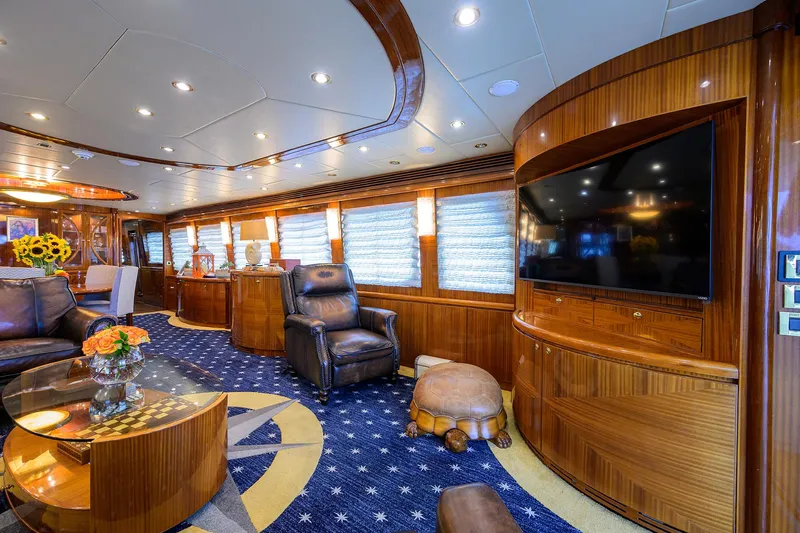 Miss Dunia Yacht Photos Pics Luxurious interior of 2008 Hargrave Raised Pilothouse yacht with elegant wood finishes and plush seating.