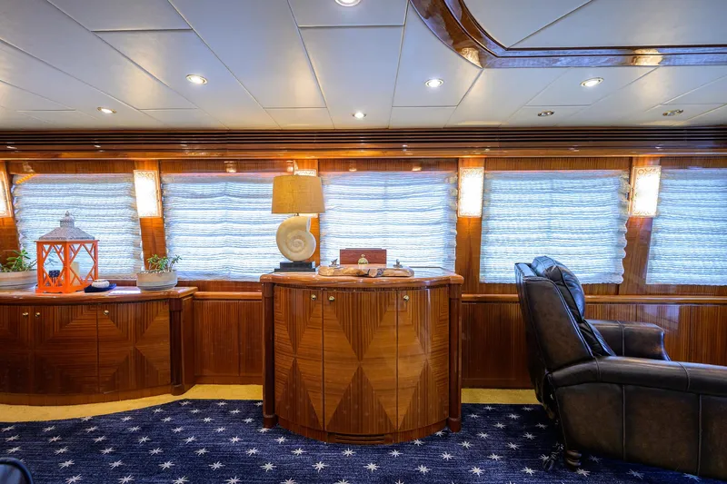 Miss Dunia Yacht Photos Pics Luxurious interior of 2008 Hargrave Raised Pilothouse yacht with elegant wood finishes and plush seating.