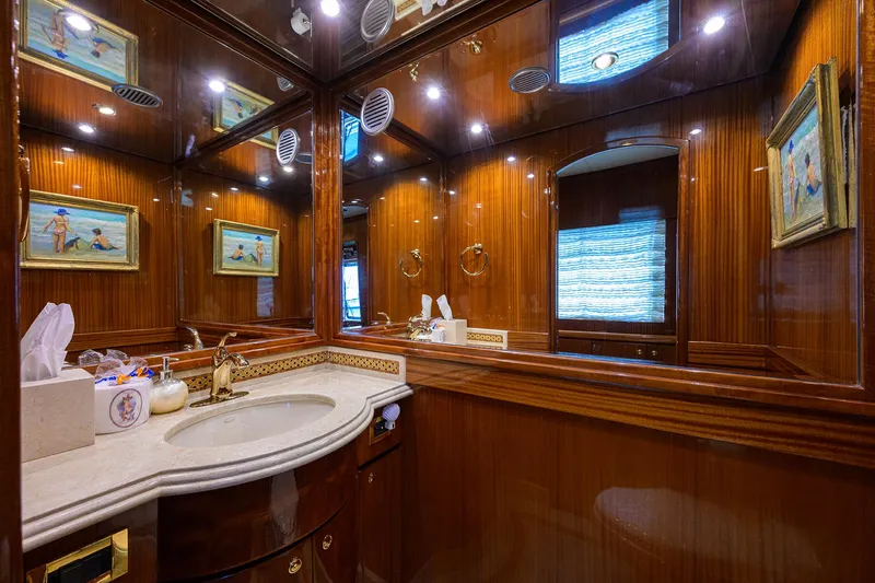 Miss Dunia Yacht Photos Pics Luxurious bathroom in 2008 Hargrave Raised Pilothouse yacht with wood paneling and elegant fixtures.