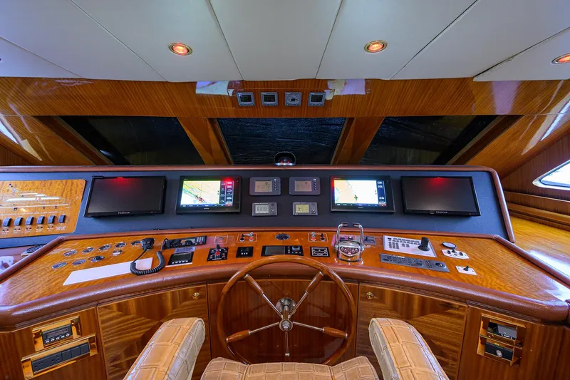Miss Dunia Yacht Photos Pics 2008 Hargrave Raised Pilothouse yacht interior with advanced navigation controls and luxurious wood finish.