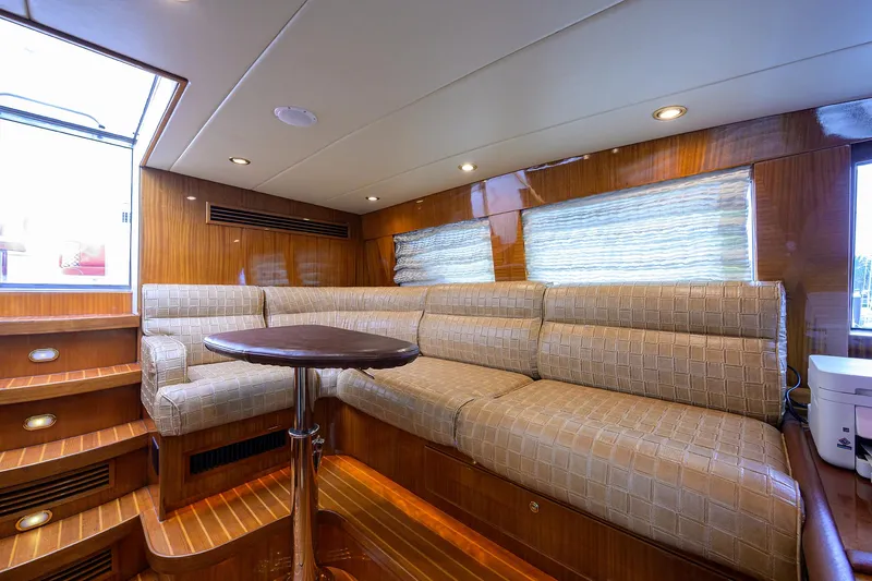 Miss Dunia Yacht Photos Pics Luxurious interior of 2008 Hargrave Raised Pilothouse yacht with plush seating and wooden accents.