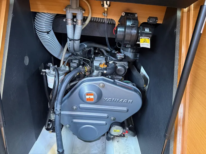 Kahuna Yacht Photos Pics Engine compartment of a 2011 Jeanneau 409 sailboat, featuring a Yanmar engine.