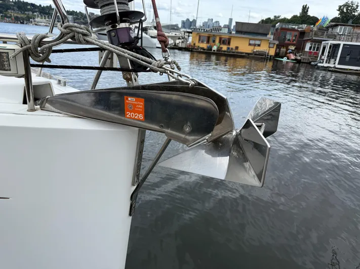 Kahuna Yacht Photos Pics Jeanneau 409 sailboat anchor with Washington registration sticker, docked near houseboats.