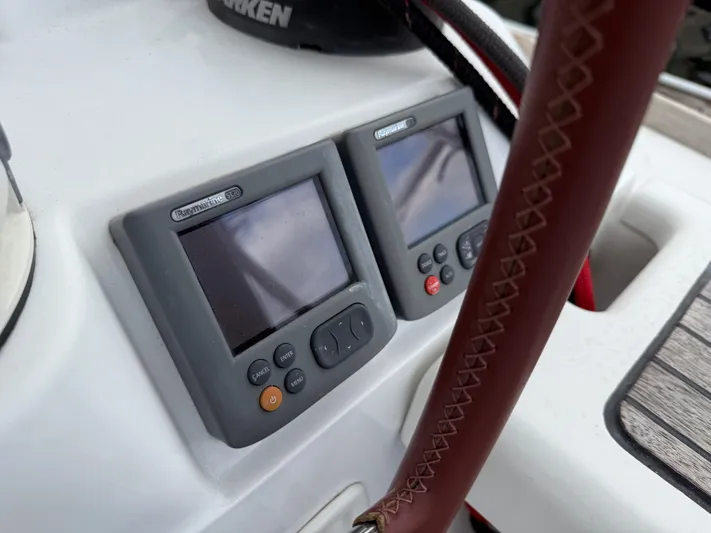 Kahuna Yacht Photos Pics Raymarine ST70 displays on 2011 Jeanneau 409 yacht, featuring leather-wrapped steering wheel.
