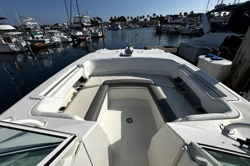  Yacht Photos Pics 2017 World Cat 295 DC boat interior at marina, showcasing spacious seating and sleek design.