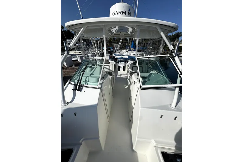  Yacht Photos Pics 2017 World Cat 295 DC boat with Garmin equipment, docked at a marina.