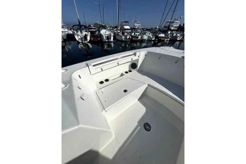  Yacht Photos Pics 2017 World Cat 295 DC boat interior with seating, docked in a marina.