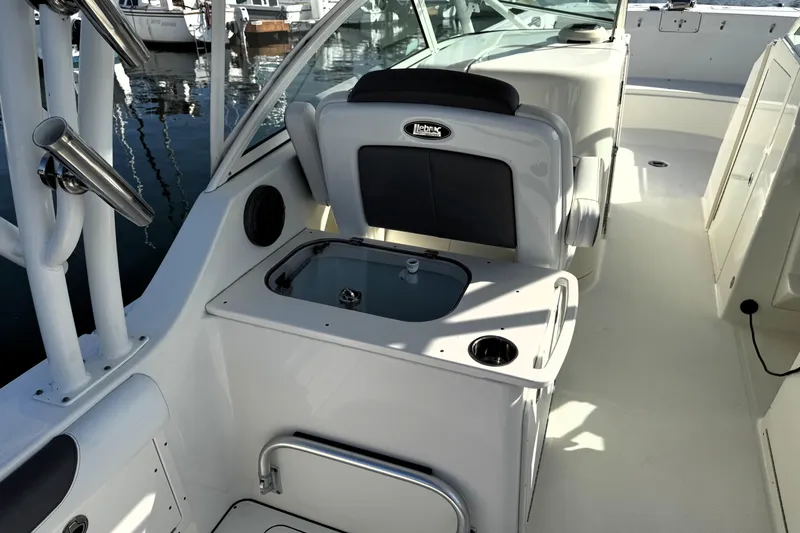  Yacht Photos Pics 2017 World Cat 295 DC boat interior with seating and storage compartments.
