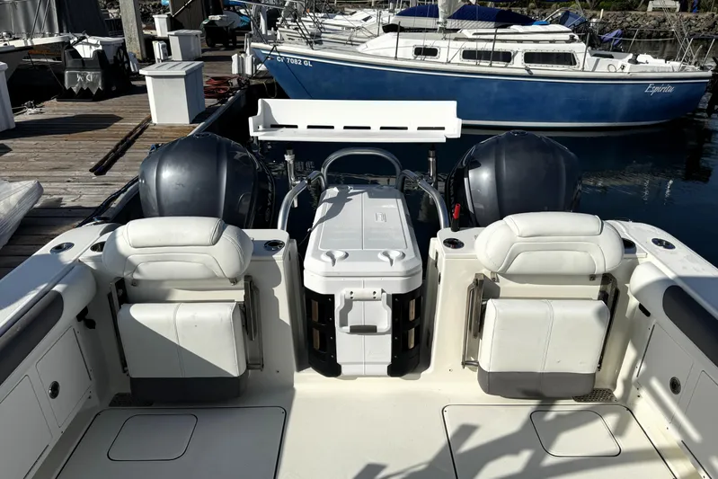  Yacht Photos Pics 2017 World Cat 295 DC boat interior with dual engines and seating at dock.