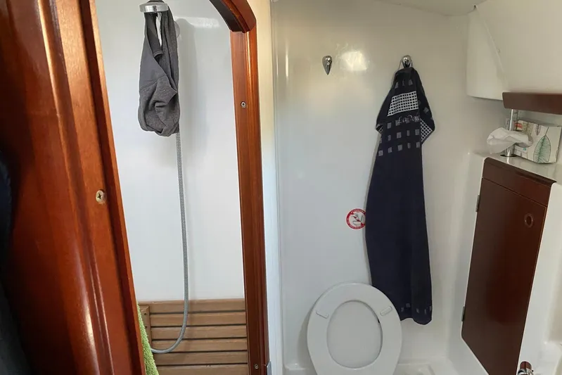 Milos Dream Yacht Photos Pics Bathroom interior of 2003 Beneteau Oceanis 50 yacht with shower and toilet.