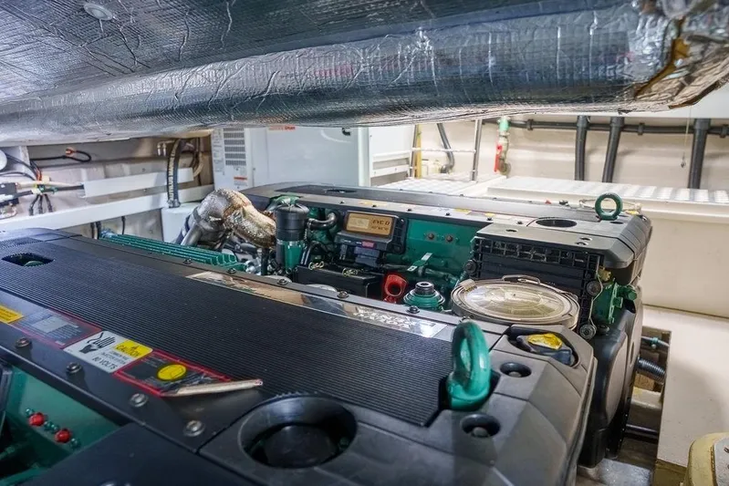 Aquaholic Yacht Photos Pics Engine room of a 2013 Sunseeker Portafino yacht, showcasing detailed machinery.