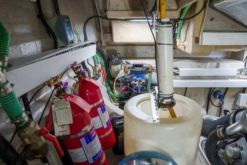 Aquaholic Yacht Photos Pics Engine room of a 2013 Sunseeker Portafino yacht with fire extinguishers and equipment.