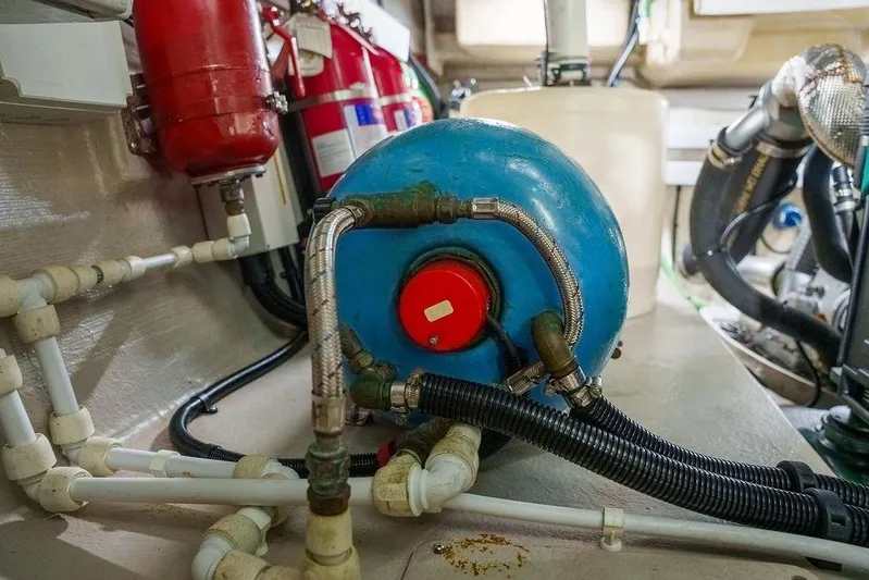 Aquaholic Yacht Photos Pics Engine room of 2013 Sunseeker Portafino yacht with blue tank and fire extinguishers.