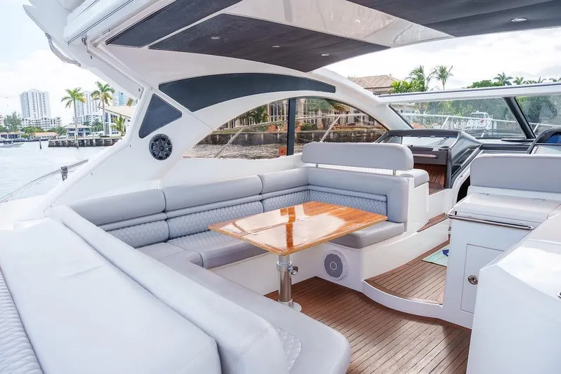 Aquaholic Yacht Photos Pics Luxurious 2013 Sunseeker Portafino yacht interior with elegant seating and wooden table.