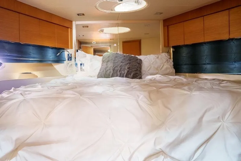 Aquaholic Yacht Photos Pics Luxurious bedroom interior of 2013 Sunseeker Portafino yacht with plush bedding.