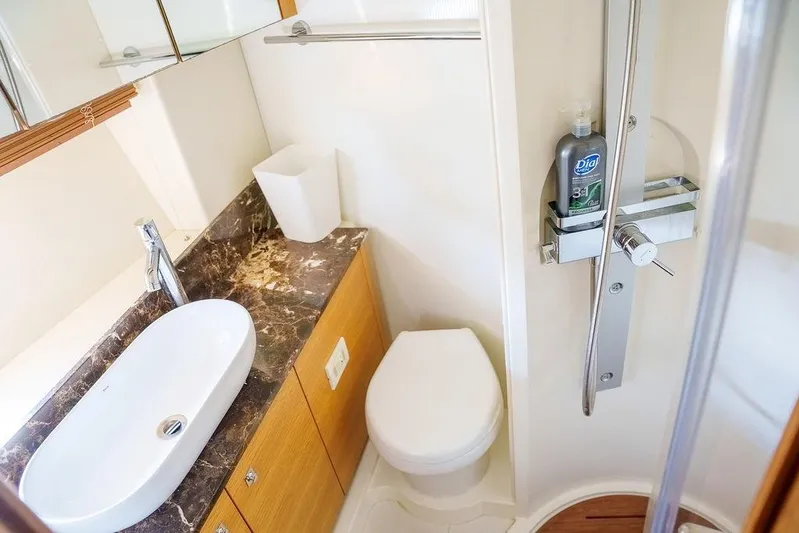 Aquaholic Yacht Photos Pics Luxurious bathroom in 2013 Sunseeker Portafino yacht with modern fixtures and marble countertop.