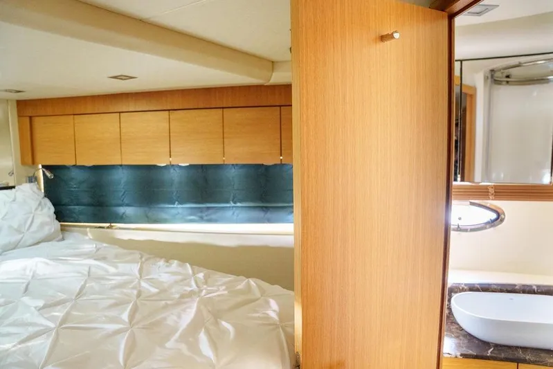 Aquaholic Yacht Photos Pics Luxurious 2013 Sunseeker Portafino yacht interior with cozy bedroom and modern bathroom.