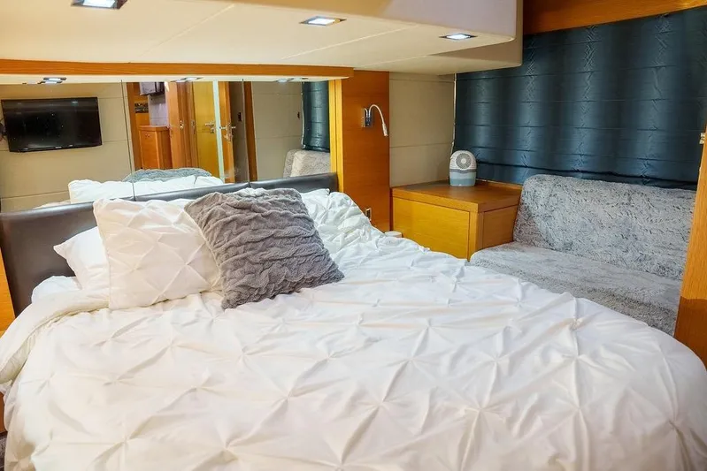 Aquaholic Yacht Photos Pics Luxurious Sunseeker Portafino 2013 yacht bedroom with cozy bedding and modern decor.