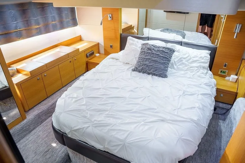 Aquaholic Yacht Photos Pics Luxurious bedroom interior of 2013 Sunseeker Portafino yacht with modern furnishings.