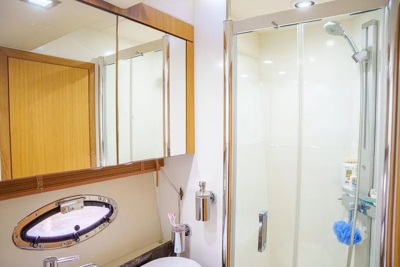 Aquaholic Yacht Photos Pics Luxurious bathroom in 2013 Sunseeker Portafino yacht with shower and mirror.