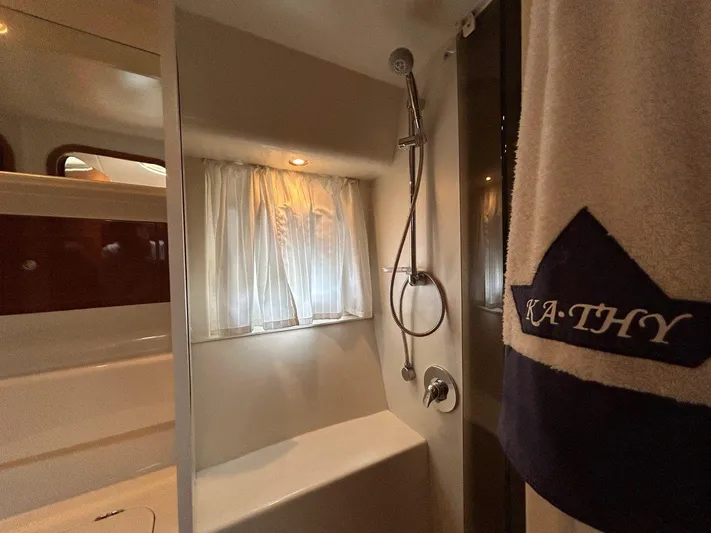 M/y Kathy Yacht Photos Pics Bathroom interior of 2006 Princess V42 yacht with shower and personalized towel.
