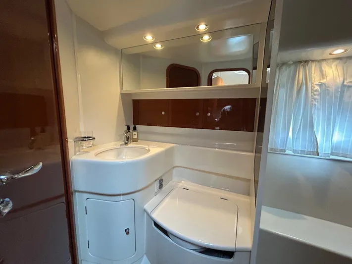 M/y Kathy Yacht Photos Pics Luxurious bathroom in 2006 Princess V42 yacht with modern fixtures and elegant design.