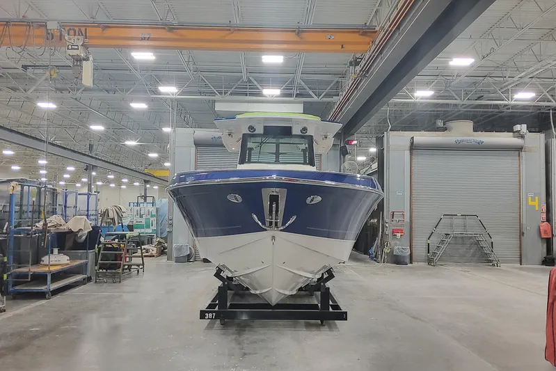  Yacht Photos Pics 2024 Formula 387 Center Console Fish boat in a manufacturing facility.