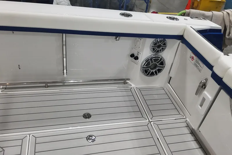  Yacht Photos Pics 2024 Formula 387 Center Console Fish boat interior with speakers and sleek flooring.