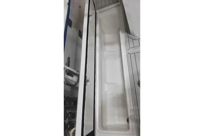  Yacht Photos Pics 2024 Formula 387 Center Console Fish boat storage compartment, open view.