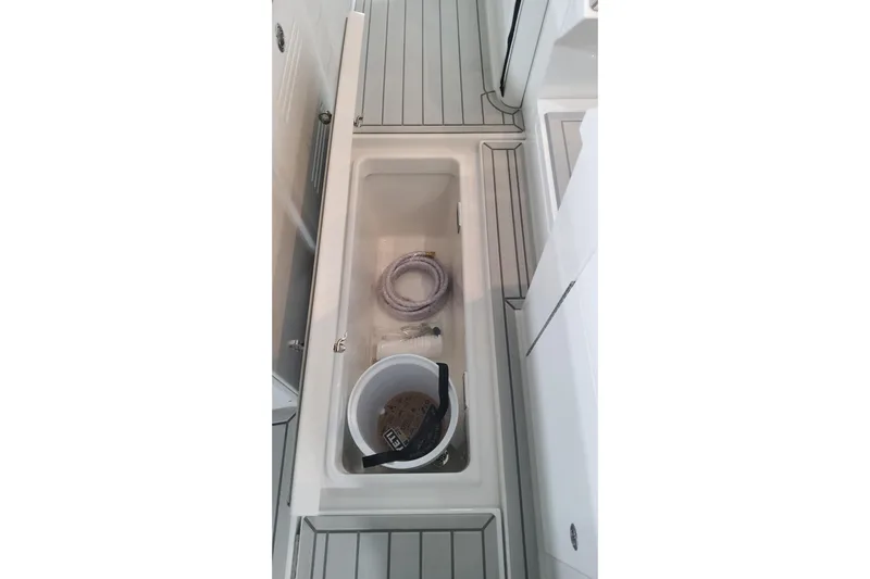  Yacht Photos Pics 2024 Formula 387 Center Console Fish storage compartment with bucket and rope.