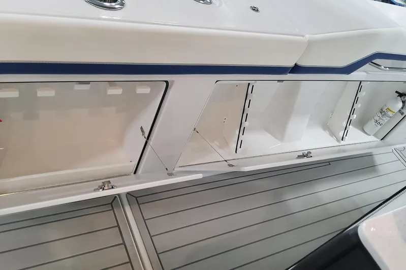  Yacht Photos Pics 2024 Formula 387 Center Console Fish boat storage compartments and deck view.