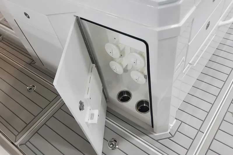  Yacht Photos Pics 2024 Formula 387 Center Console Fish boat storage compartment with open door.