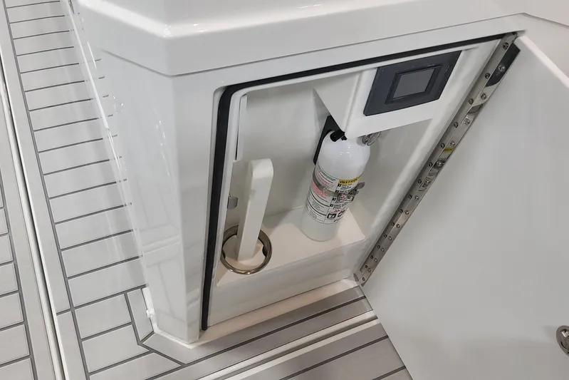  Yacht Photos Pics 2024 Formula 387 Center Console Fish storage compartment with fire extinguisher.