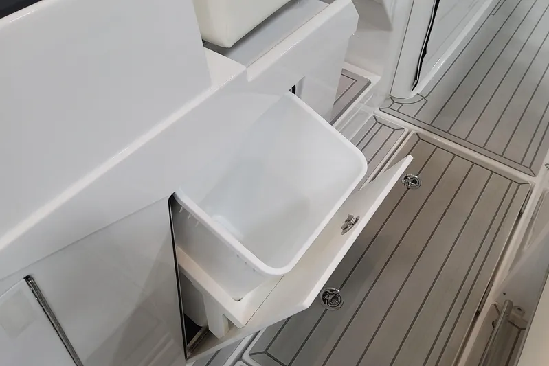  Yacht Photos Pics 2024 Formula 387 Center Console Fish boat with open storage compartment.