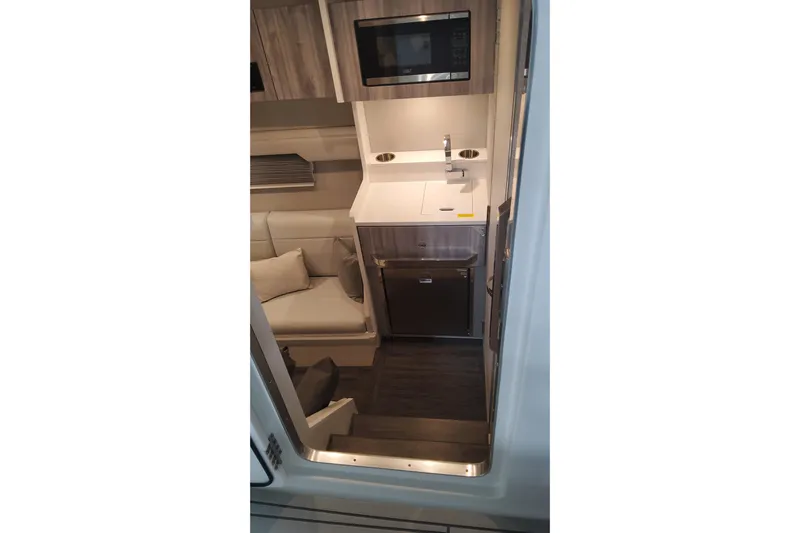  Yacht Photos Pics 2024 Formula 387 Center Console Fish interior with kitchenette and seating area.