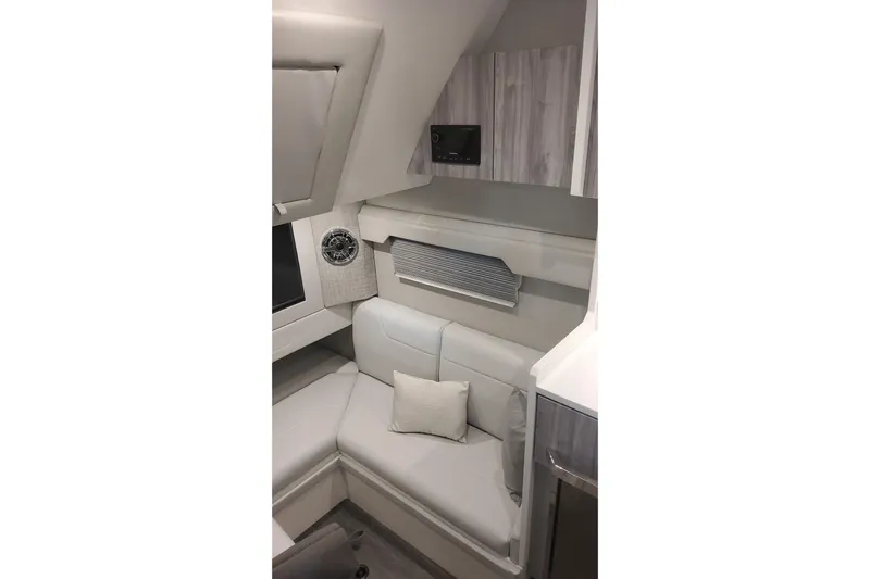  Yacht Photos Pics 2024 Formula 387 Center Console Fish cabin interior with modern seating and cabinetry.