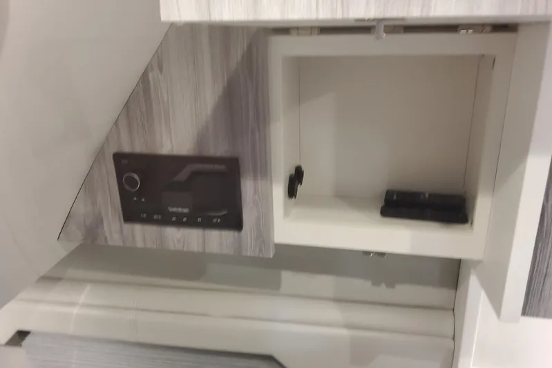  Yacht Photos Pics 2024 Formula 387 Center Console Fish interior storage compartment and control panel.