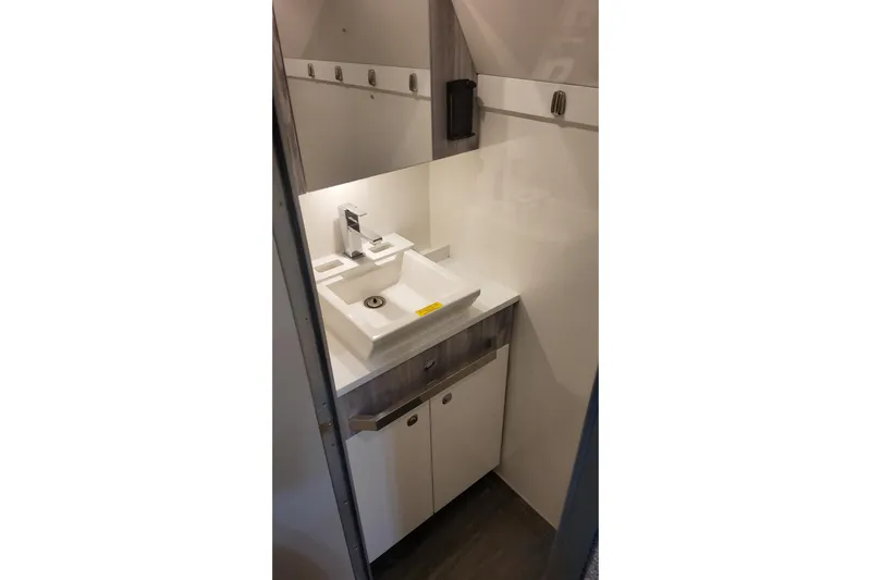  Yacht Photos Pics 2024 Formula 387 Center Console Fish boat bathroom with modern sink and cabinetry.