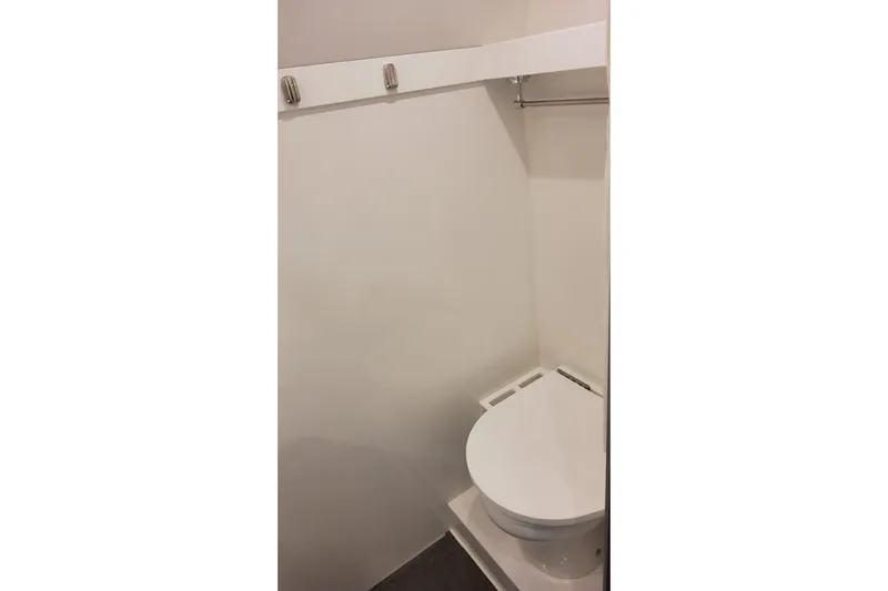  Yacht Photos Pics 2024 Formula 387 Center Console Fish boat interior bathroom with toilet.