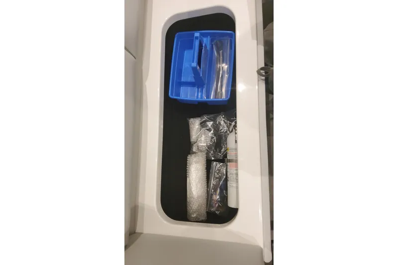  Yacht Photos Pics Storage compartment in 2024 Formula 387 Center Console Fish boat with organized tools.