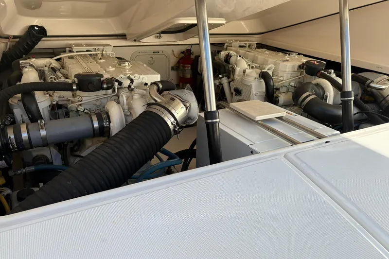  Yacht Photos Pics Engine compartment of 2008 Tiara Yachts 3000 Open, showcasing dual engines and components.