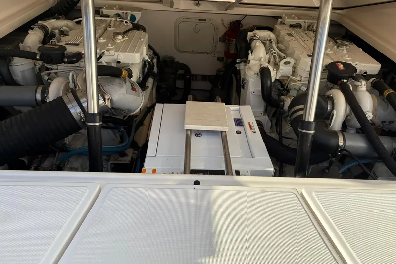  Yacht Photos Pics Engine compartment of a 2008 Tiara Yachts 3000 Open, showcasing dual engines and equipment.