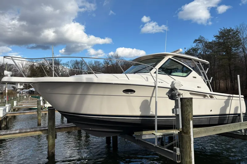  Yacht Photos Pics 2008 Tiara Yachts 3000 Open on lift, docked under blue sky.