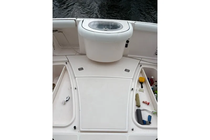  Yacht Photos Pics 2008 Tiara Yachts 3000 Open deck with storage compartments and fishing equipment.