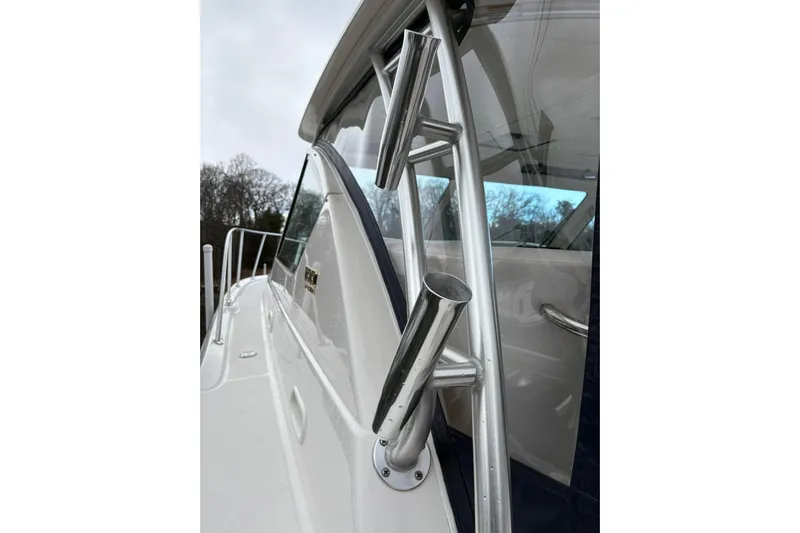 Yacht Photos Pics 2008 Tiara Yachts 3000 Open, close-up of fishing rod holders and cabin window.